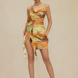 Mira | Asymmetrischer Seitenschlitz Neckholder-Minikleid mit Kunstdruck