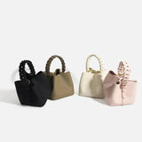 Yamina | Elegante strukturierte Handtasche mit geflochtenem Henkel