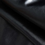 Nerine | Kontrastreicher Kunstleder-Skaterrock mit ausgestellten Stoffeinsätzen und High-Waist-Schnitt