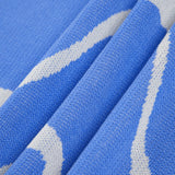 Maisie | Figurschmeichelndes Midikleid mit abstraktem Muster und zarten Spaghettiträgern