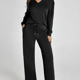 Damen Freizeitanzug mit Zipper-Pullover und weiter Hose