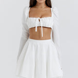 Dagny | Weißes Oberteil mit Puffärmeln und Minirock mit Schleife